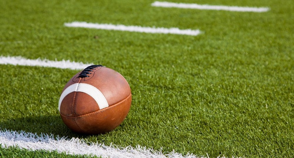 A American football on a green football field