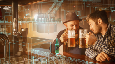 Two men in a bar cheersing beer glasses with a digital factory overlay representing the brewing business