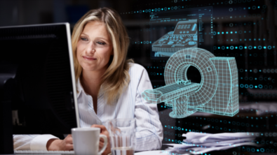 Woman at a computer with a mug. A digital overlay of factory devices is over her shoulder.