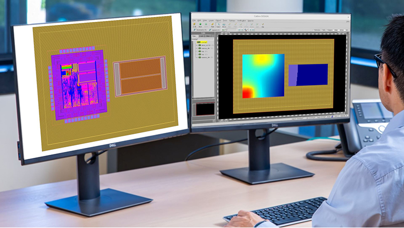 A person working at a desk with two computer monitors displaying IC design layouts in Siemens EDA's Calibre 3DThermal software. The left monitor shows a detailed 3D IC design, while the right monitor displays the thermal heatmaps.  