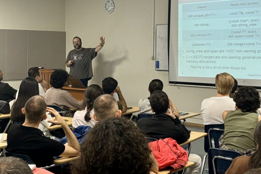 Dr. Fedor Pikus delivering a lecture on new C++ features at American University of Armedia in October 2024.