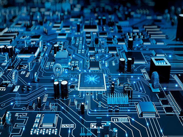 Processor IC highlighted on a PCB, in a cool blue tinted environment