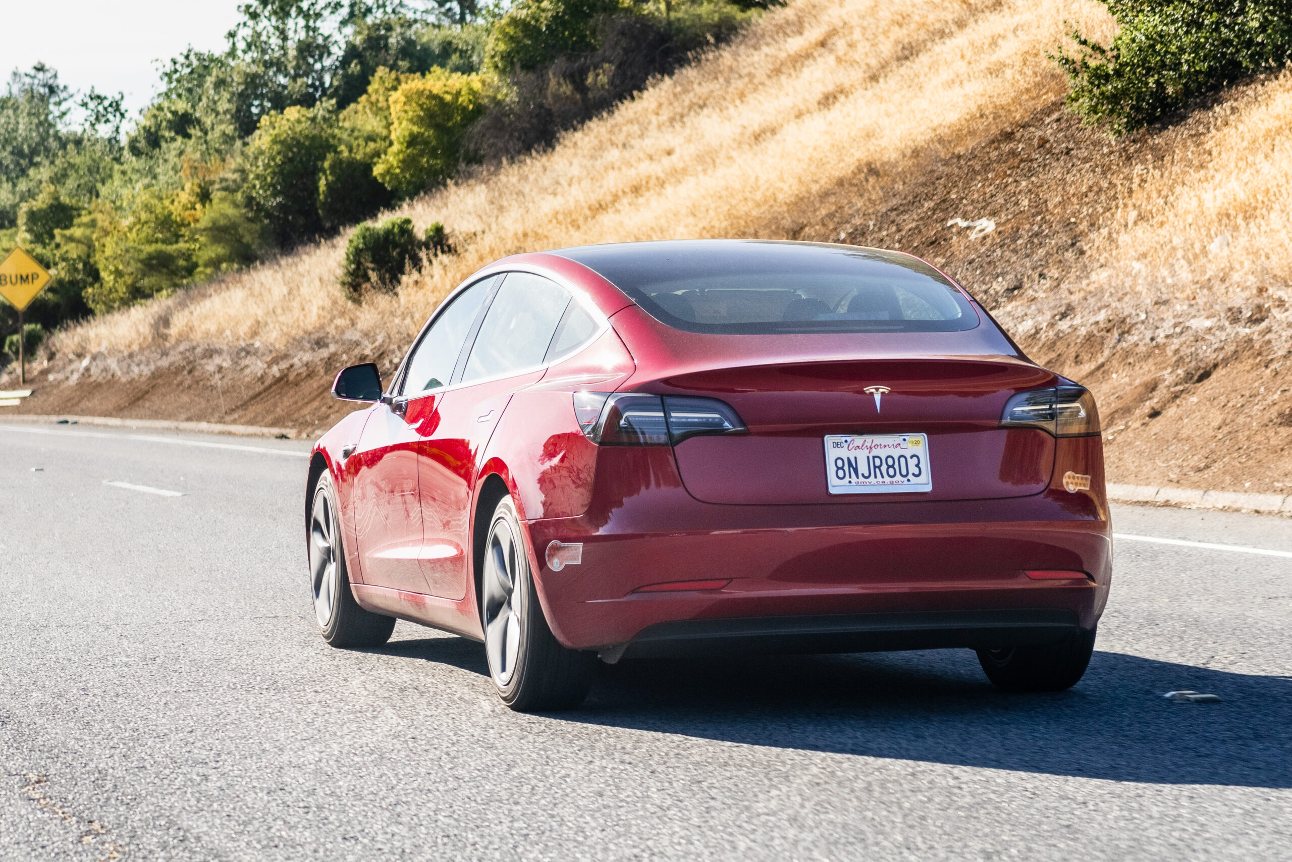 Tesla Model 3 driving on the freeway