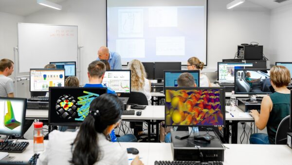 A class of students learning how to use 3D CAE simulation with Simcenter