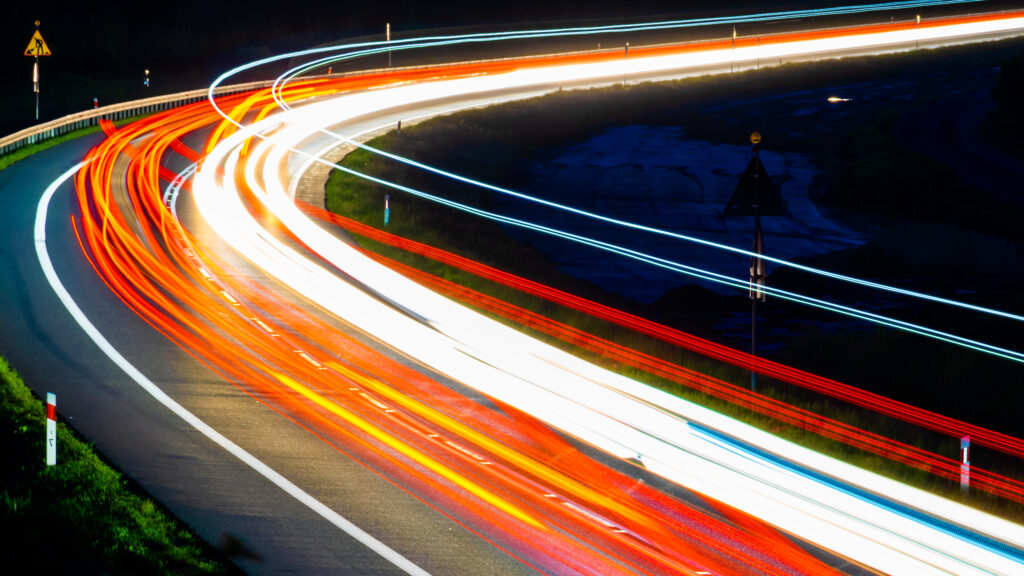 Car lights at nights - orange shades with road works