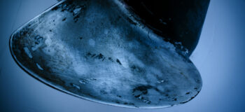 A propeller blade underwater showing the adverse impacts of cavitation