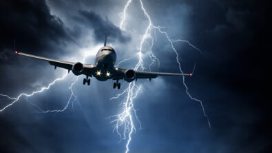 Aircraft travelling through stormy sky
