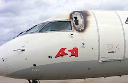 Picture of a hole on the aircraft because of a lightning strike.