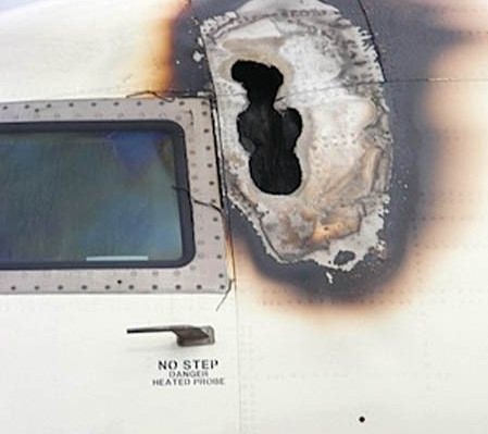Zoomed-in picture of a hole on the aircraft because of a lightning strike.
