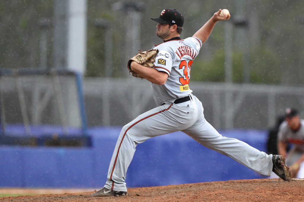 Massingham pitching with the Canberra Calvary in 2013.