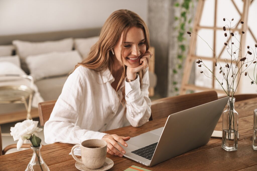 Happy woman using computer