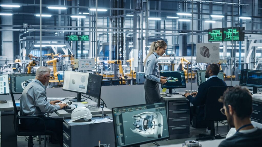 Image of engineers collaborating in a manufacturing facility.