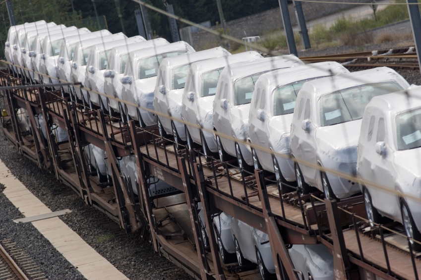 New cars are transported on a train
