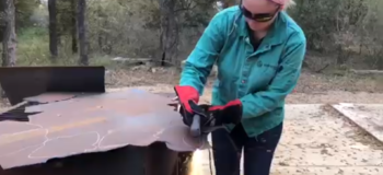 Sophia welding a piece of metal