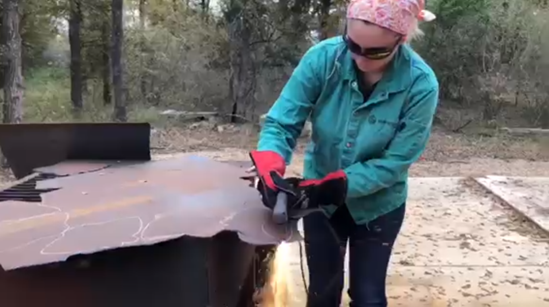 Sophia welding a piece of metal