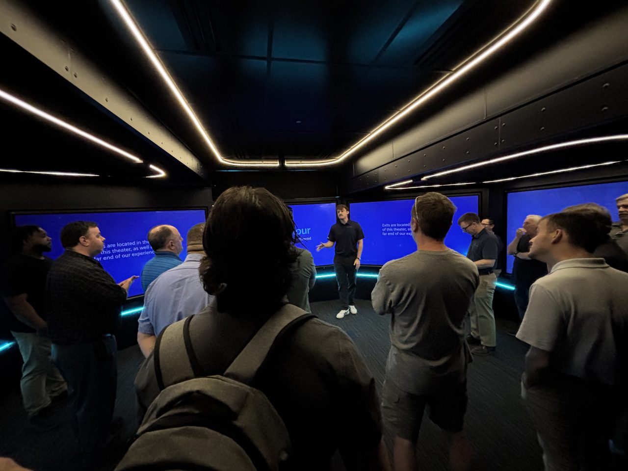 Guests inside the Siemens explore tour truck are being taken through a presentation on smart manufacturing.