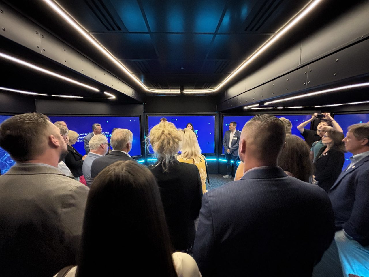 Guests inside the eXplore tour truck are asking questions about various aspects of smart manufacturing.